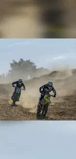 Motocross riders racing on a dusty desert trail with blue sky background.