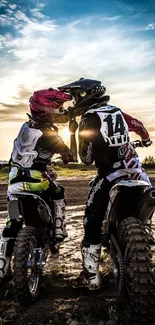 Two motocross riders at sunset on a dirt track, capturing adventure and thrill.