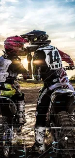 Two motocross riders at sunset, creating an adventurous vibe on a mobile wallpaper.