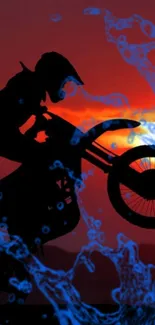 Motocross silhouette against a sunset with vibrant blue splashes.