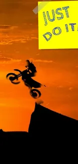 Motocross rider silhouetted against sunset with 'Just Do It' text.