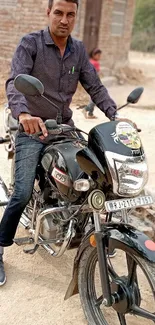 Man on motorbike in desert setting, casual attire, clear skies.