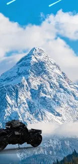 Motorbike and snowy mountain under a clear blue sky.