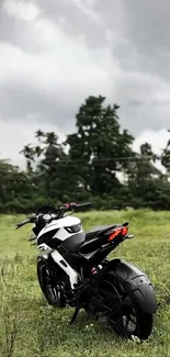 Motorbike parked on a field with lush greenery and cloudy sky.