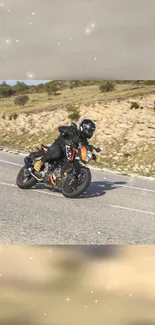 Motorbike racing on scenic open road.