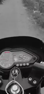 Close-up of motorbike speedometer showing 58 kmph on a black dashboard.