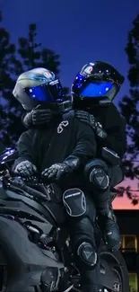 Couple on motorcycle against sunset backdrop.