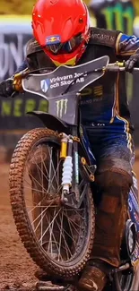 Motorcycle rider racing on a dirt track.