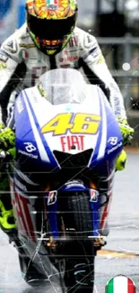 Motorcycle racer in vibrant gear speeding on a rainy track.