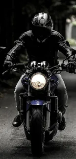 Motorcycle rider travels through dark forest path.