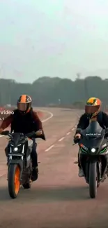 Two motorcyclists on a scenic open road.