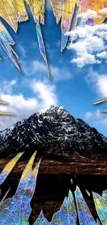 Snow-capped mountain under blue sky with abstract colorful shards.