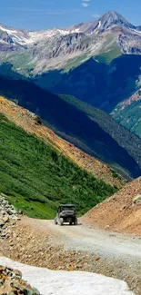 4x4 vehicle on rugged mountain trail with panoramic view.