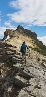 Hiker explores rocky mountain ridge under a blue sky.