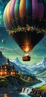 Hot air balloon over mountain landscape at night.