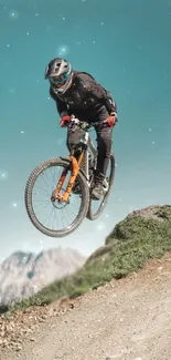 Mountain biker performing a high jump on a scenic trail with blue sky backdrop.