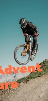 Cyclist performing a jump on a mountain bike with a sky backdrop.