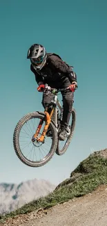 Mountain biking adventure on a scenic trail with a cyclist airborne in dynamic action.