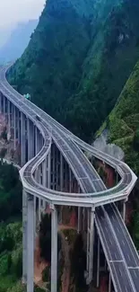 A scenic mountain bridge with lush green surroundings.