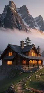 Cozy mountain cabin enveloped in morning mist.