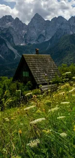 Scenic mountain cabin with lush greenery and alpine peaks.