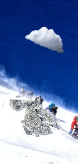 Climbers ascending snow-covered mountain under blue sky.