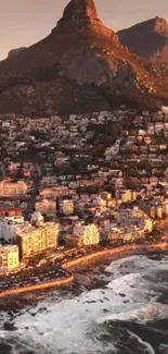 Coastal cityscape with mountains and ocean view at sunset.