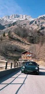 Scenic mountain road with sports car and cabin.