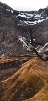 Helicopter flying over rugged mountain terrain with dramatic natural scenery.