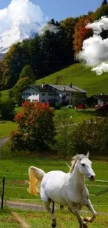 White horse running in green meadow with mountains in the background.