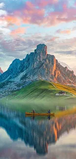 Serene mountain lake reflection with colorful sunset sky.