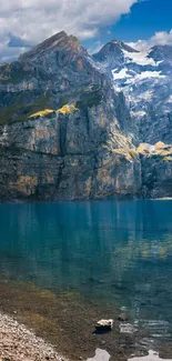 Scenic mountain lake wallpaper with clear blue skies.