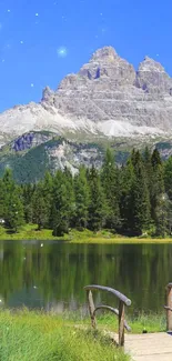 Scenic mountain lake with blue sky and green trees, reflecting tranquility.