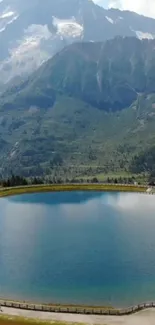 Tranquil mountain lake with forest and peaks.