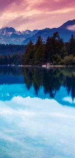 Serene mountain lake with sunset reflection and peaks.