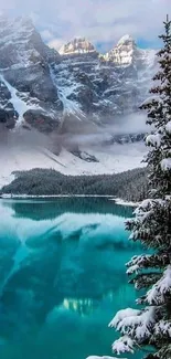 Snowy mountain lake with turquoise water and frosted evergreen trees.