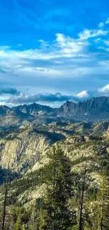 Majestic mountain range under a vibrant blue sky with lush greenery.