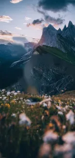 Majestic mountains under a twilight sky with wildflowers in the foreground.