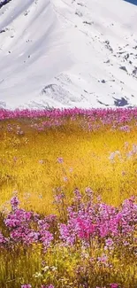 Snowy mountain with vibrant flowers and meadow.