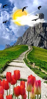 Vibrant mountain path with tulips under a sunny sky.