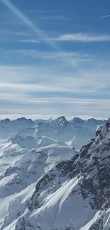 Snowy mountain range under a clear blue sky.