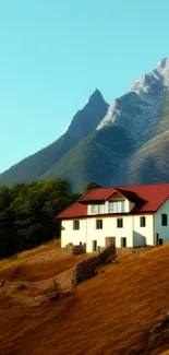 Mountain house with hills and blue sky - mobile wallpaper.