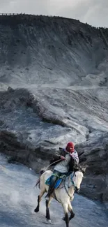 Rider on horseback traversing rugged mountain terrain.