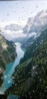 Mountain river with clouds and raindrops on lens.