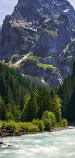 Majestic mountain and river with dense green forest wallpaper.