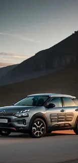 SUV on a calm mountain road at dusk with a moody, serene ambiance.