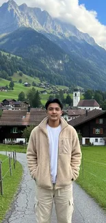 Man standing in lush mountain village scenery.