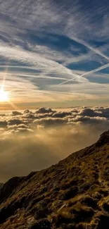 Stunning mountain sunrise with clouds and a glowing sky.