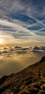 Sunrise over mountains with clouds and golden rays in the sky.