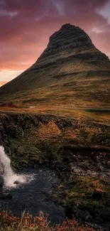 Mountain peak with sunset sky and waterfall in vibrant colors.